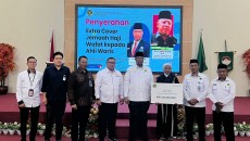 Kemenag dan Garuda Indonesia Mulai Serahkan  Cover Asuransi Jemaah Haji Yang Meninggal