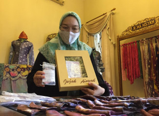 Angel Eva Christine, Mualaf Promosikan Jumputan Khas Palembang hingga ke Amerika